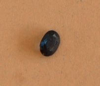 An oval faceted loose sapphire