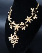 A Victorian yellow metal and seed pearl collar necklace.
