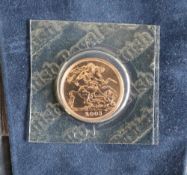 An Elizabeth II gold sovereign,