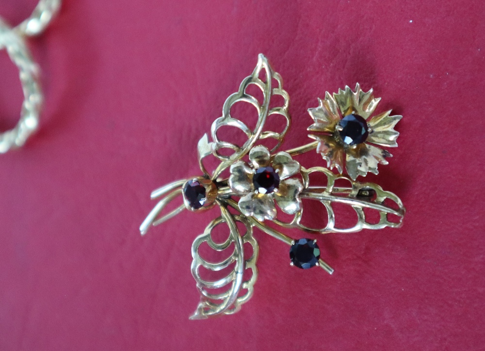 A 9ct yellow gold brooch of floral form set with garnets together with a pair of 9ct gold hoop - Image 3 of 4