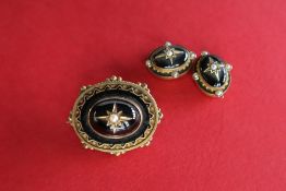 A Victorian yellow metal, black enamel and seed pearl mourning brooch