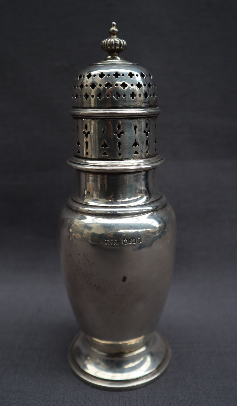 A George V silver sugar caster with a turned domed cover above a baluster body on a spreading foot, - Image 2 of 3