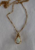 An opal and diamond pendant,