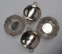 A pair of late Victorian silver bon bon dishes of circular form decorated with fruit and leaves,