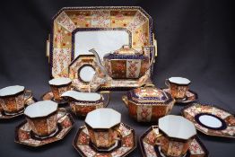A Wedgwood Imari pattern part tea service, comprising a twin handled tray, teapot,