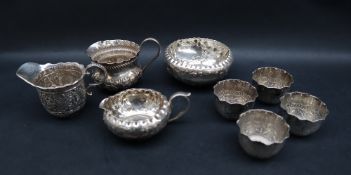 A late Victorian silver jug and bowl set, decorated with leaves and flowers, initialled, Sheffield,