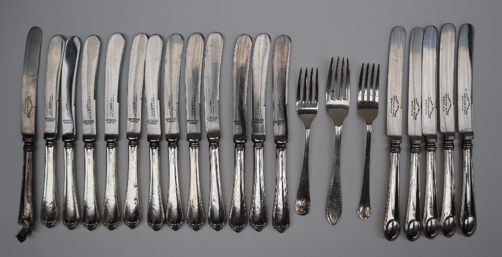A set of twelve silver handled side knives together with a set of six silver handled side knives