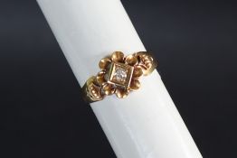 An 18ct gold ring set with an old cut diamond to a floral setting, size M 1/2, approximately 3.