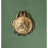 A Victorian gold double sovereign dated 1887 in a yellow metal mount,