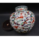 A Chinese polychrome porcelain vase painted with bats in flight amongst clouds,