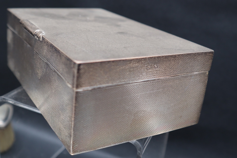 An Elizabeth II silver cigarette box of rectangular form with engine turned decoration, Birmingham, - Image 4 of 6