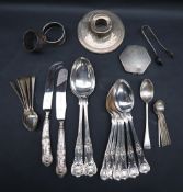 A set of six Elizabeth II silver Kings pattern dessert spoons together with matching table spoons,