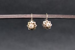 A pair of diamond earrings, set with round brilliant cut diamond each approximately 0.