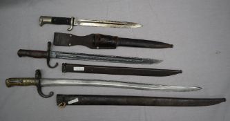 A French 1864 sabre bayonet and scabbard together with a Japanese Arisaka 1897 pattern bayonet and