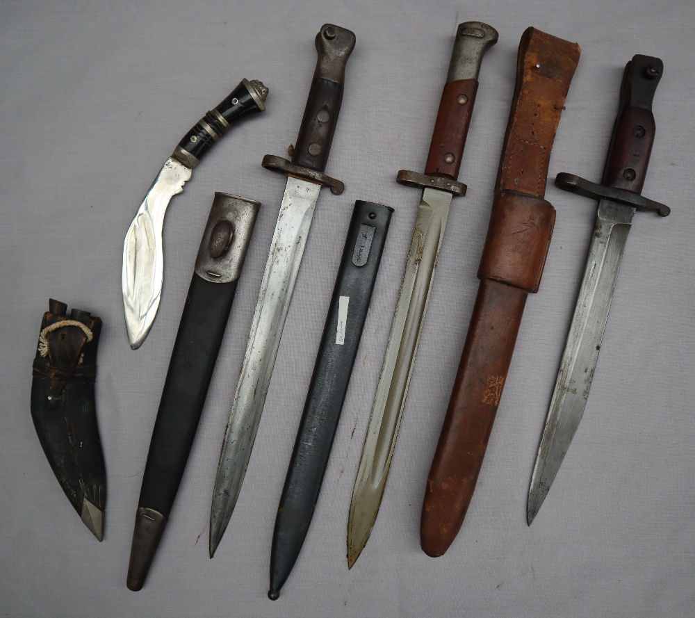 A British 1888 pattern MKI 2nd type bayonet and scabbard together with a German bayonet,