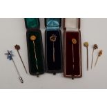 A 15ct gold stick pin of floral form,