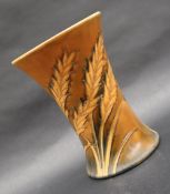 A Moorcroft pottery waisted vase decorated with sheaves of wheat to a brown ground,