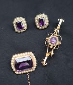 An amethyst and seed pearl brooch of rounded rectangular shape,