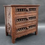 A 19th century oak miniature chest of drawers,