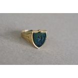 A yellow metal signet ring, with bloodstone shield with intaglio of an eagle, size P,