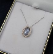 An aquamarine and diamond pendant,