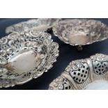A pair of silver heart shaped dishes,