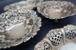 A pair of silver heart shaped dishes,