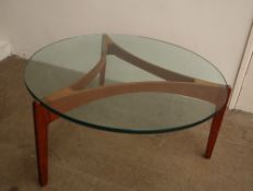 A Mid 20th century Danish teak and glass coffee table in the style of Sven Ellekaer,