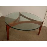 A Mid 20th century Danish teak and glass coffee table in the style of Sven Ellekaer,