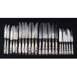 A set of six white metal 800 standard table knives together with a matching set of side knives,