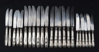 A set of six white metal 800 standard table knives together with a matching set of side knives,