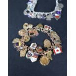 A 9ct yellow gold charm bracelet set with 9ct gold and enamel county shields,