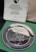 An Elizabeth II silver plate designed by Doris Lindner in commemoration of the achievements of