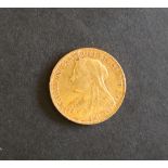A Victorian gold sovereign dated 1898,