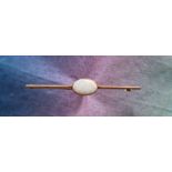 A 9ct gold opal set bar brooch, the opal approximately 12mm x 8mm, approximately 3.