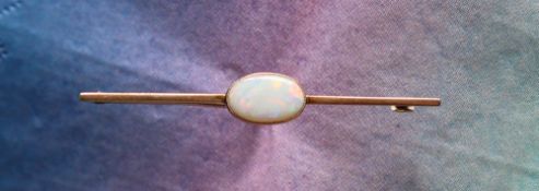 A 9ct gold opal set bar brooch, the opal approximately 12mm x 8mm, approximately 3.