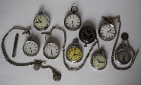 A silver open faced pocket watch on a silver Albert watch chain,
