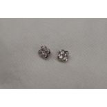 A pair of diamond cluster earrings,