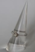 A solitaire diamond ring, the round old cut diamond approximately 0.