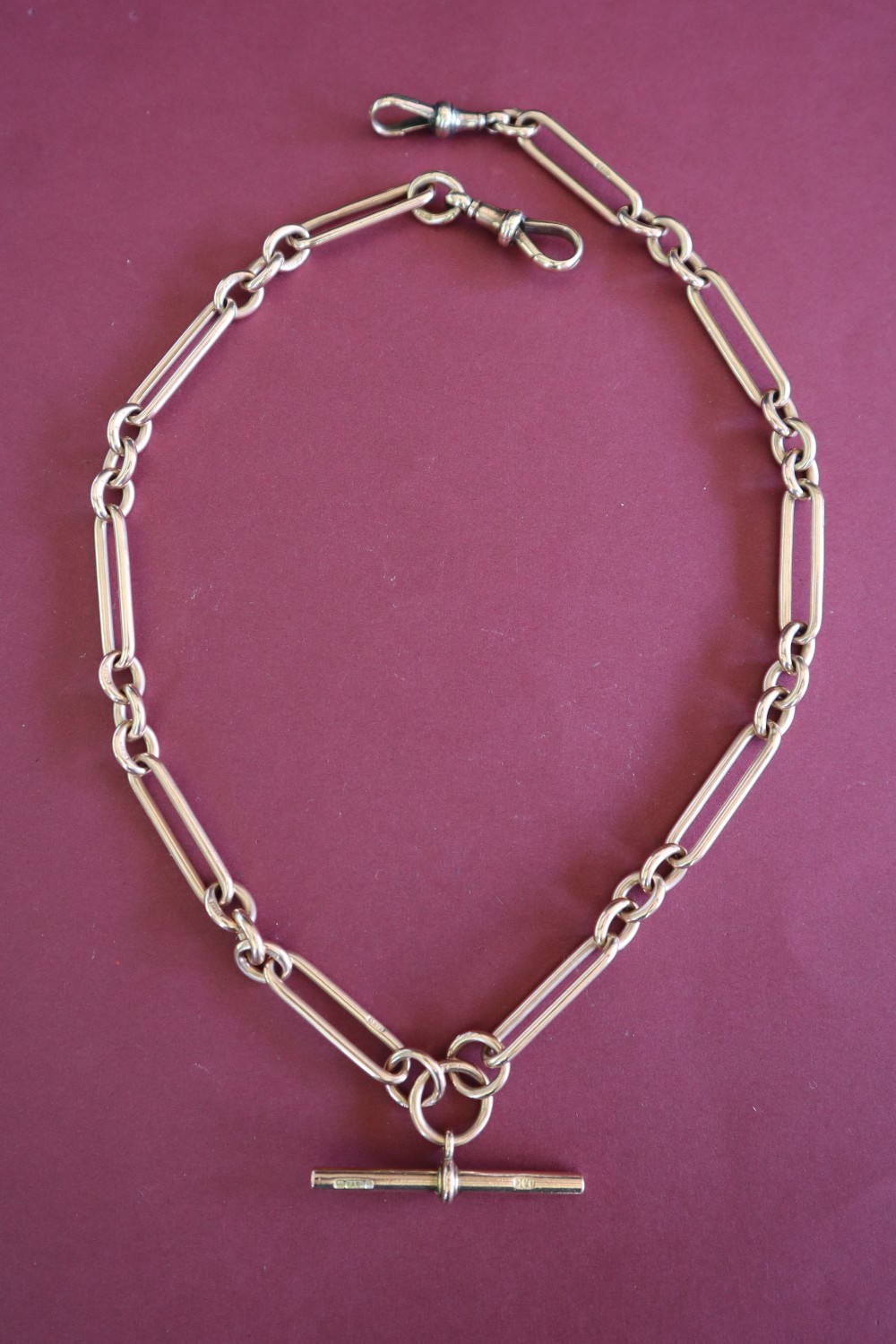 A 9ct yellow gold double albert watch chain with oval and circular links with a central T bar, - Image 2 of 3
