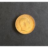 An Edward VII gold sovereign,