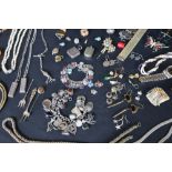 Assorted costume jewellery including earrings, beaded necklaces, faux pearls, brooches, rings,