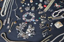 Assorted costume jewellery including earrings, beaded necklaces, faux pearls, brooches, rings,