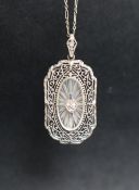 An Edwardian white metal pendant,