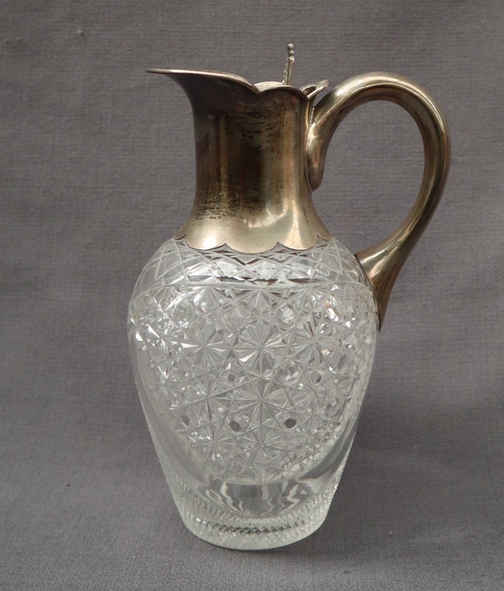 A George V silver topped and hobnail cut glass claret jug, with a leaf thumb piece, Sheffield, 1922,