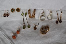 A pair of peridot and seed pearl drop earrings, together with a pair of amethyst drop earrings,