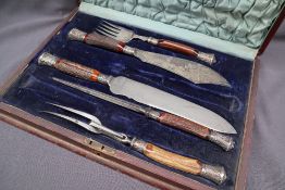 A Victorian silver mounted antler handled part carving set, comprising fish servers, carving knife,