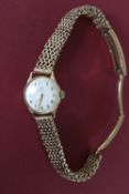 A lady's 9ct yellow gold Omega wristwatch,