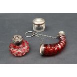 A white metal mounted cornucopia shaped cranberry glass scent bottle,