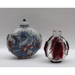 A Chinese blue and white porcelain snuff bottle of circular form decorated with figures fighting a